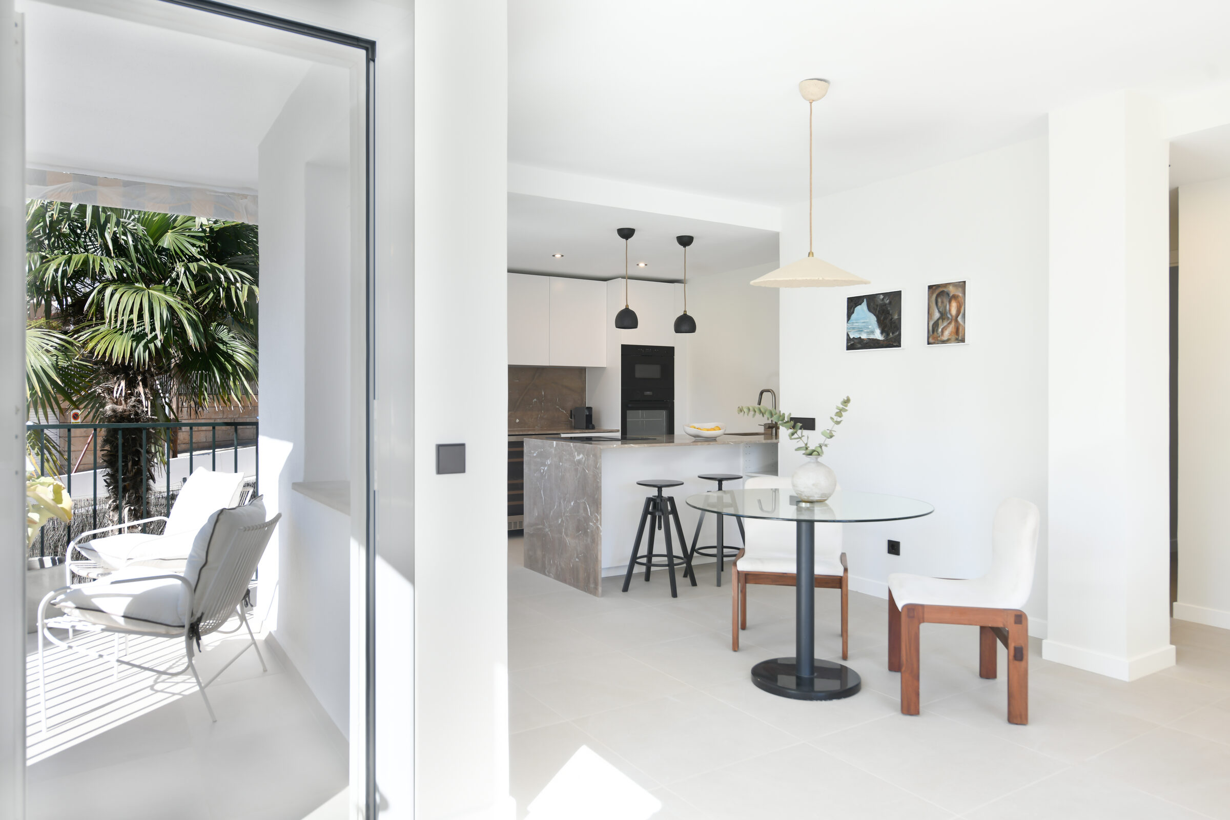 Terrace doors opening from the living area onto the dining room and kitchen.